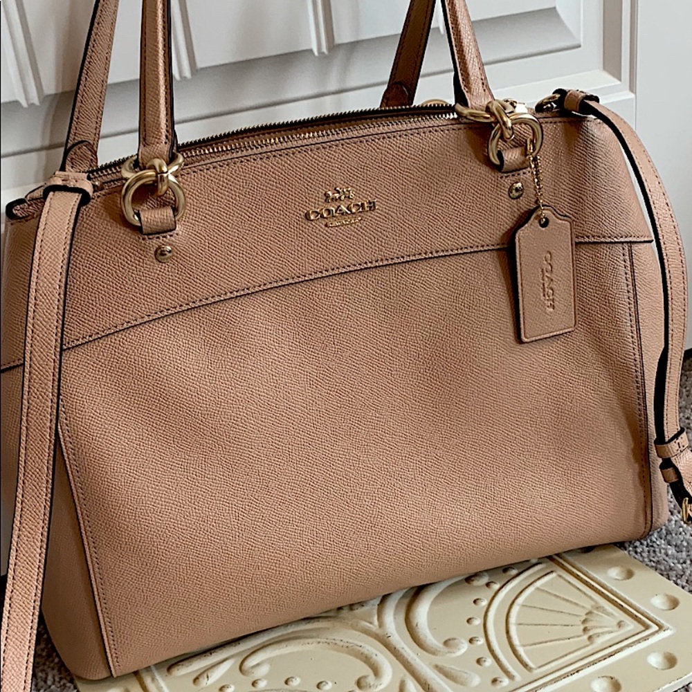 Beautiful blush Coach bag with gold accents!
